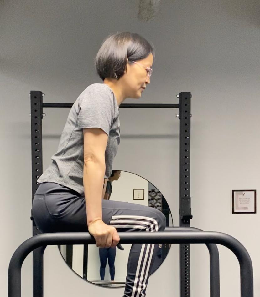 Julie Holding Tuck L-sit